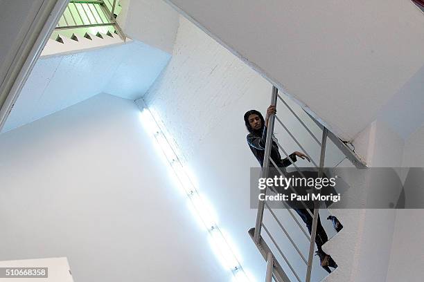 Model ascends the stairs backstage at the Rodarte Fall 2016 fashion show during New York Fashion Week on February 16, 2016 in New York City.