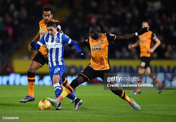 Anthony Knockaert of Brighton battles with Tom Huddlestone and Mo Diame of Hull City during the Sky Bet Championship match between Hull City and...