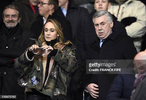 Former PSG coach Carlo Ancelotti and his wife Mariann Barrena McClay attend the Champions League round of 16 first leg football match between Paris...