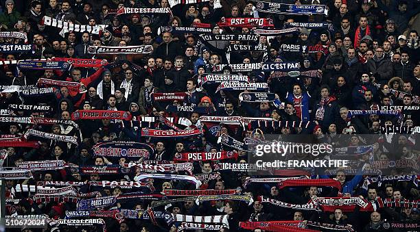Paris Saint-Germain's supporters cheer during the Champions League round of 16 first leg football match between Paris Saint-Germain and Chelsea FC on...