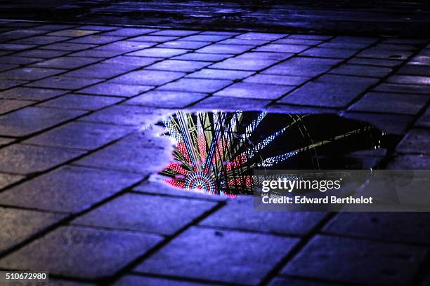 The Big Wheel reflecting into a puddle, on Place de La Concorde, on February 4, 2016 in Paris, France.