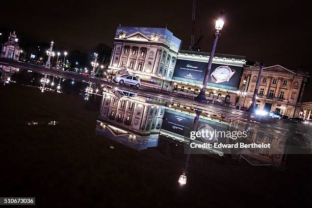 Buildings reflecting into a puddle, on Place de La Concorde, on February 4, 2016 in Paris, France.