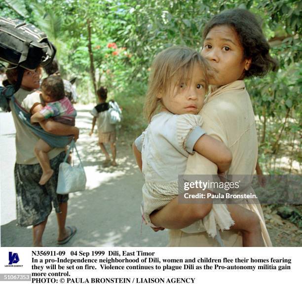 Sep 1999 Dili, East Timor In A Pro-Independence Neighborhood Of Dili Women And Children Flee Their Homes Fearing They Will Be Set On Fire.Violence...