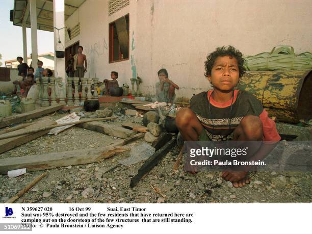 Oct 99 Suai, East Timor Saui Was 95% Destroyed And The Few Residents That Have Returned Here Are Camping Out On The Doorsteop Of The Few Structures...