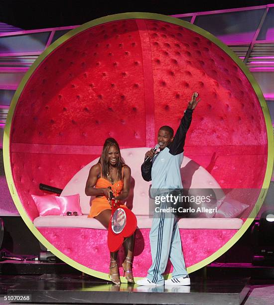 Host Jamie Foxx serenades tennis player Serena Williams on stage at the 12th Annual ESPY Awards held at the Kodak Theatre on July 14, 2004 in...