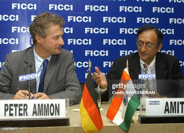 Federation of Indian Chambers of Commerce and Industry Secretary General Amit Mitra talks with director general for German Economic Affairs and...