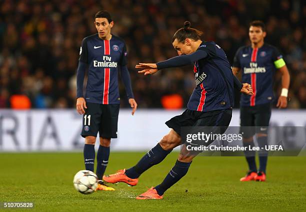Zlatan Ibrahimovic of Paris Saint-Germain scores their first goal from a free kick during the UEFA Champions League round of 16 first leg match...