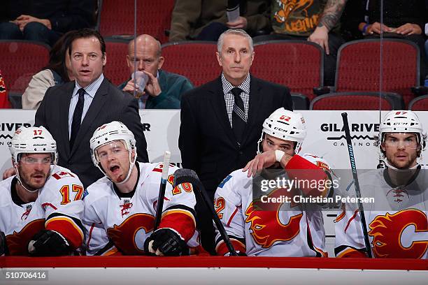 Assistant coach Martin Gelinas and head coach Bob Hartley of the Calgary Flames on the bench during the NHL game against the Arizona Coyotes at Gila...