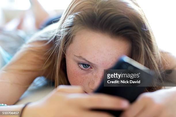 girl using mobile phone - child smartphone stock pictures, royalty-free photos & images