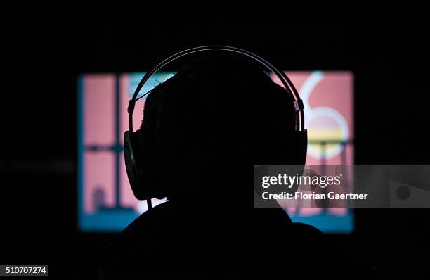 Person sits in front of a monitor with a headset at the University of Applied Sciences for Engineering and Economics on February 15, 2016 in Berlin.