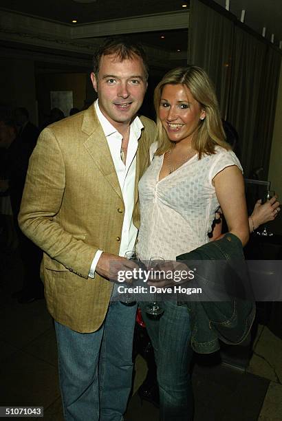 John Leslie and girlfriend Angie Stewart attends Jane Moore's book launch party at the Embassy Club on July 14, 2004 in London. Moore is a Sun and...