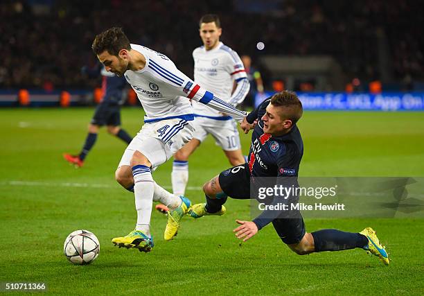Cesc Fabregas of Chelsea battles with Marco Verratti of Paris Saint-Germain during the UEFA Champions League round of 16 first leg match between...