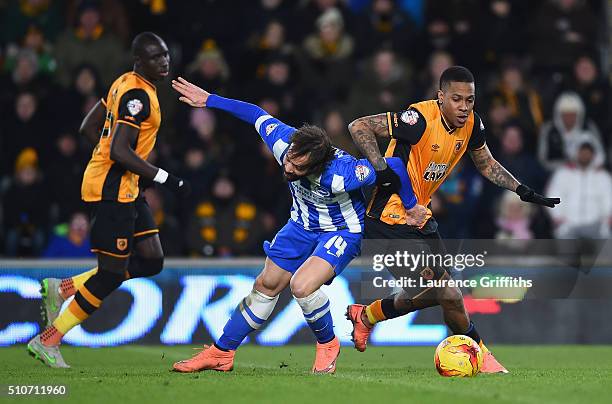 Inigo Calderon of Hull City battles with Abel Hernandez of Brighton and Hove Albionduring the Sky Bet Championship match between Hull City and...