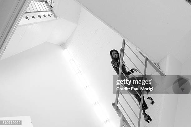 Model ascends the stairs backstage at the Rodarte Fall 2016 fashion show during New York Fashion Week on February 16, 2016 in New York City.