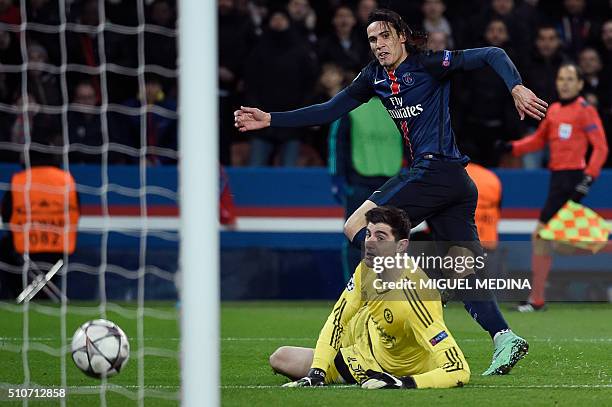 Paris Saint-Germain's Uruguayan forward Edinson Cavani scores a goal past Chelsea's Belgian goalkeeper Thibaut Courtois during the Champions League...
