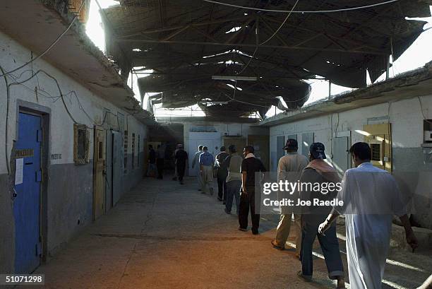 Prisoners are moved between cells as they wait to be processed for release from Abu Ghraib prison on July 15, 2004 west of Baghdad, Iraq. The U.S....