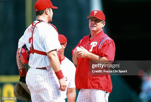 Manager Larry Bowa of the Philadelphia Phillies talks with his catcher Todd Pratt while making a pitching change during a Major League Baseball game...