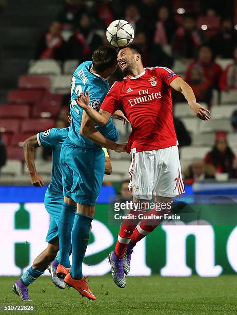 BenficaÕs midfielder from Greece Andreas Samaris with FC ZenitÕs forward Artem Dzyuba in action during the UEFA Champions League Round of 16: First...