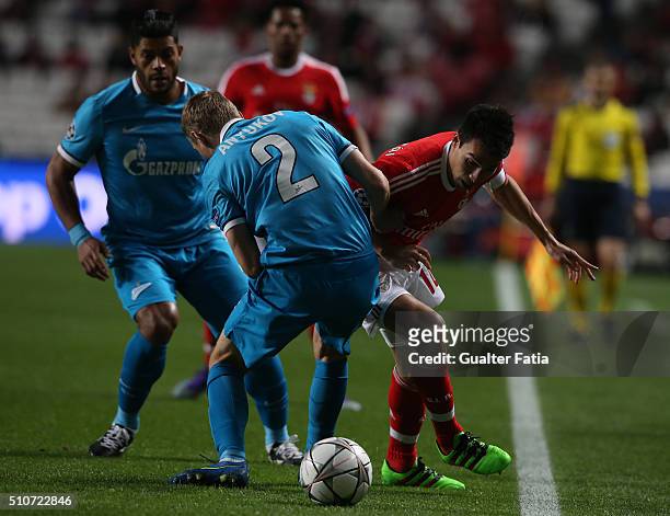 BenficaÕs midfielder from Argentina Nico Gaitan with FC ZenitÕs defender Aleksandr Anyukov in action during the UEFA Champions League Round of 16:...