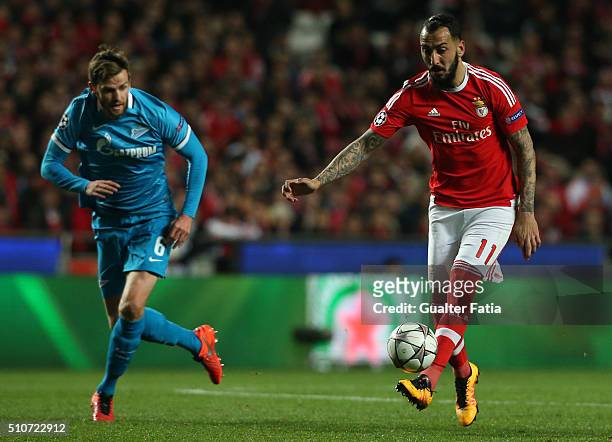 BenficaÕs forward from Greece Kostas Mitroglou with FC ZenitÕs defender from Belgium Nicolas Lombaerts in action during the UEFA Champions League...