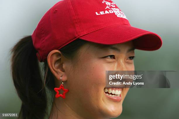 Michelle Wie smiles as she looks on during the final round of the U.S. Women's Open on July 4, 2004 at Orchards Golf Club in South Hadley,...