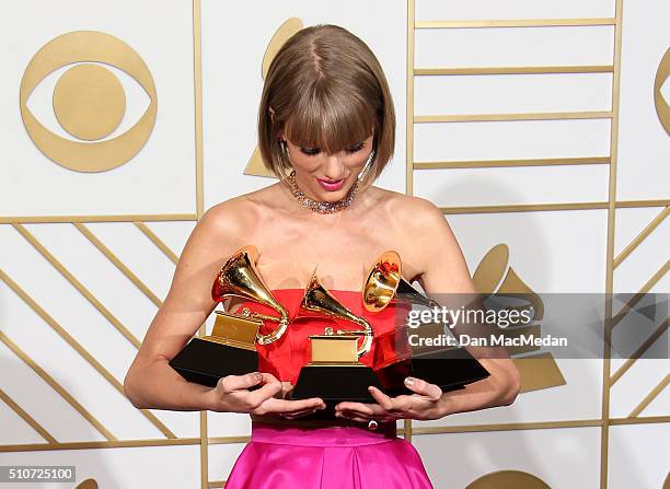 Singer Taylor Swift, winner of the awards for Album of the Year and Best Pop Album for '1989' and Best Music Video for 'Bad Blood,' poses in the...