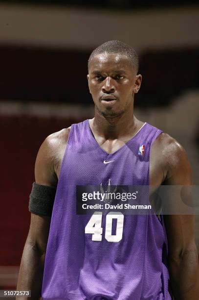 Pape Sow of the Toronto Raptors stands on the court during the 2004 NBA Pro Summer League game against the Minnesota Timberwolves at Target Center on...