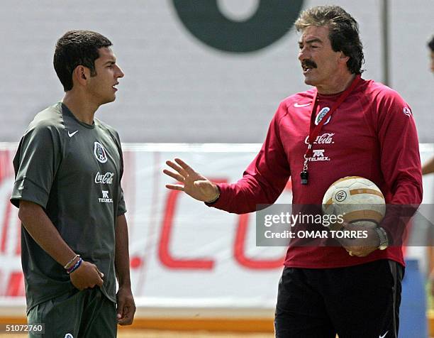 Ricardo Lavolpe, coach of Mexico's National team talks to Jaime Lozano during the training of his team at Santo Toribio of Magravejo school in...