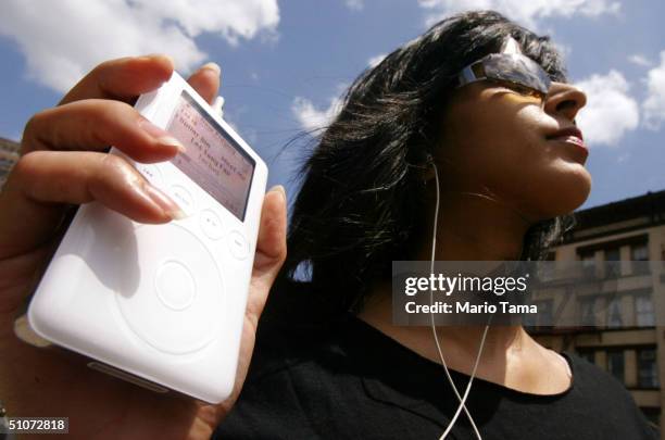 Keeno Ahmed listens to her iPod mini digital music player July 15, 2004 in New York City. Apple Computer Inc. Reported quarterly earnings that more...