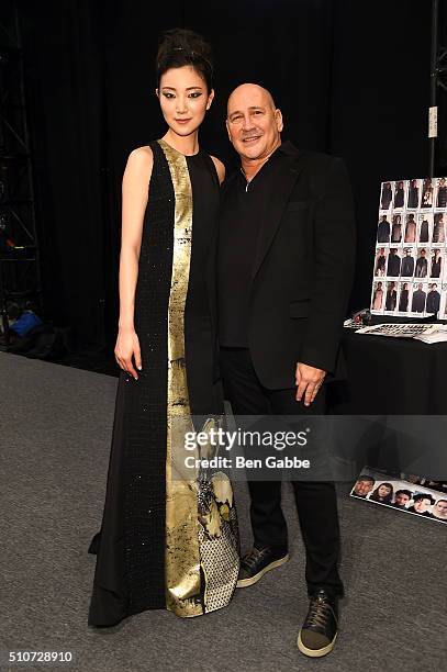 Designer Carmen Marc Valvo and model backstage at Carmen Marc Valvo F/W 2016 at The Arc, Skylight at Moynihan Station on February 16, 2016 in New...