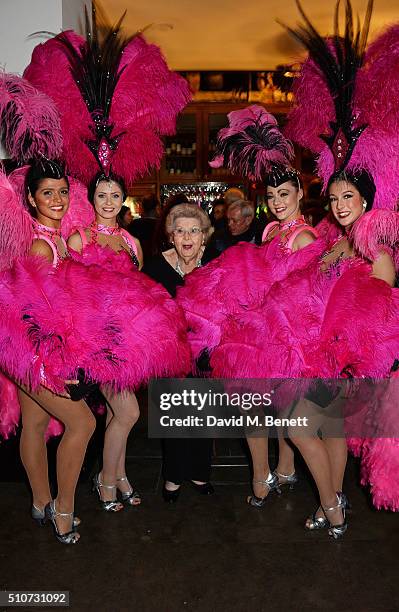 Original Windmill Girl Margaret McGrath poses with dancers at the press night after party for "Mrs Henderson Presents" at The National Cafe on...