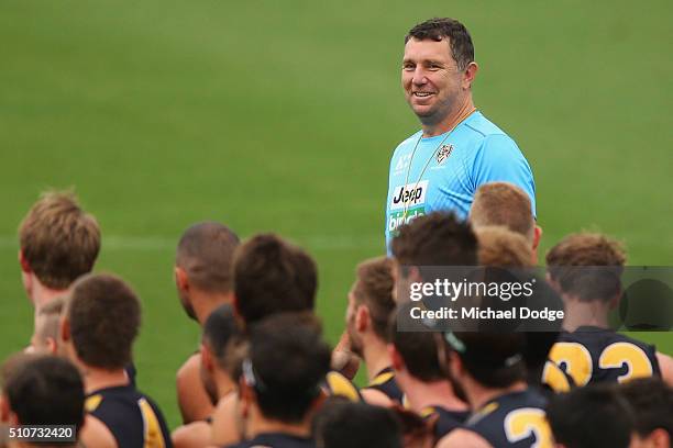 Assistant coach Brendon Lade reacts after being told he will coach the team in the round one NAB Cup during a Richmond Tigers AFL media session at...