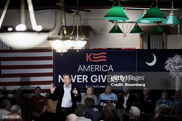 John Kasich, governor of Ohio and 2016 Republican presidential candidate, speaks during a town hall event at Murray's Neighborhood Bar and Grill in...
