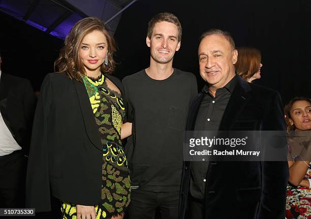 Model Miranda Kerr, Co-Founder & CEO of SnapChat Evan Spiegel and Len Blavatnik, Chairman of Access Industries and owner of Warner Music Group attend...