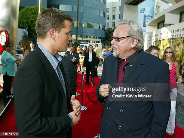 Actor Matt Damon and Robert Rosen, Dean of the UCLA School of Theater, Film and Television, talk at the premiere of Universal's "The Bourne...