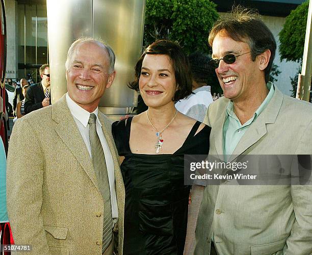 Producers Frank Marshall and Patrick Crowley and actress Franka Potente pose at the premiere of Universal's "The Bourne Supremacy" at the Arclight...
