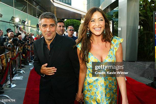 Actor George Clooney and Lisa Snowdon arrive at the premiere of Universal's "The Bourne Supremacy" at the Arclight Cinemas on July 15, 2004 in Los...