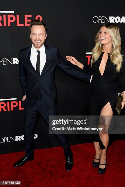 Actor Aaron Paul and director Lauren Parsekian attend the premiere of Open Road's "Triple 9" at Regal Cinemas L.A. Live on February 16, 2016 in Los...