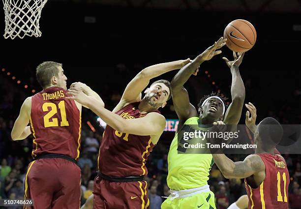 Johnathan Motley of the Baylor Bears rebounds the ball against Matt Thomas of the Iowa State Cyclones, Georges Niang of the Iowa State Cyclones, and...