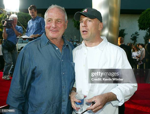 Producer Jerry Weintraub and actor Bruce Willis pose at the premiere of Universal's "The Bourne Supremacy" at the Arclight Cinemas on July 15, 2004...