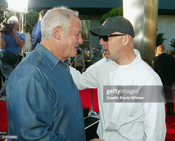 Producer Jerry Weintraub and actor Bruce Willis pose at the premiere of Universal's "The Bourne Supremacy" at the Arclight Cinemas on July 15, 2004...