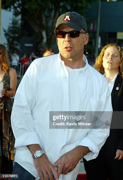 Actor Bruce Willis arrives at the premiere of Universal's "The Bourne Supremacy" at the Arclight Cinemas on July 15, 2004 in Los Angeles, California.