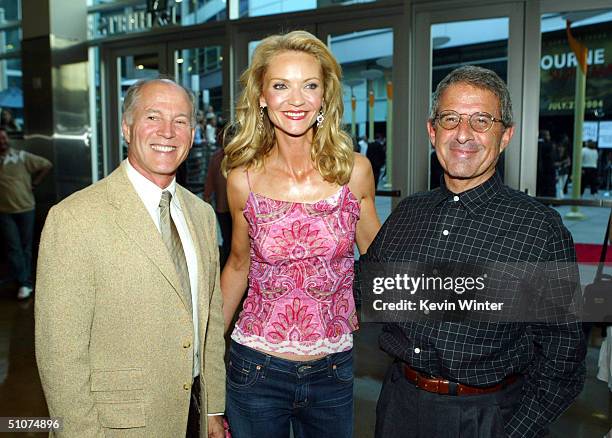 Producer Frank Marshall , actress Joan Allen and Universal's Ron Meyer pose at the premiere of Universal's "The Bourne Supremacy" at the Arclight...