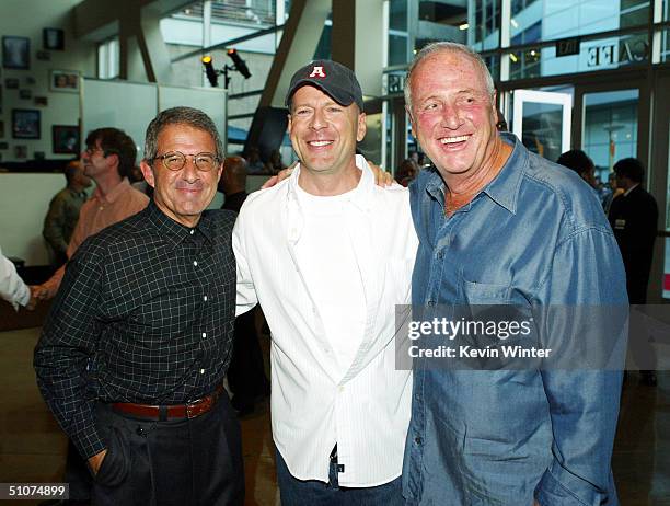 Universal's Ron Meyer , actor Bruce Willis and producer Jerry Weintraub arrive at the premiere of Universal's "The Bourne Supremacy" at the Arclight...
