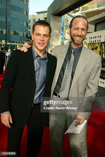 Actor Matt Damon and producer Paul L. Sandberg pose at the premiere of Universal's "The Bourne Supremacy" at the Arclight Cinemas on July 15, 2004 in...