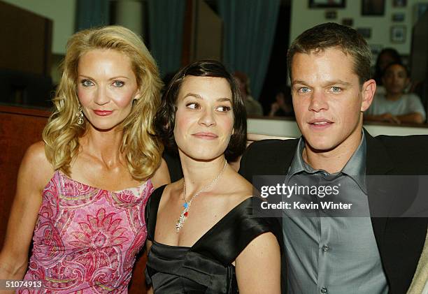 Actors Joan Allen , Matt Damon and Franka Potente pose at the premiere of Universal's "The Bourne Supremacy" at the Arclight Cinemas on July 15, 2004...