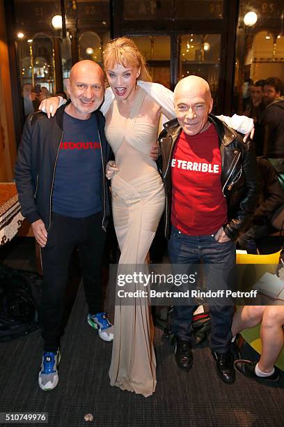 Arielle Dombasle standing between Artists 'Pierre et Gilles', Gilles Blanchard and Pierre Commoy attend Arielle Dombasle presents her Perfume "Le...