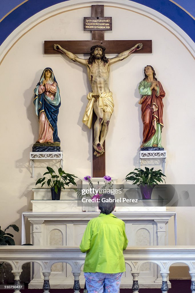 Hispanic Catholic Worshipping Jesus Christ