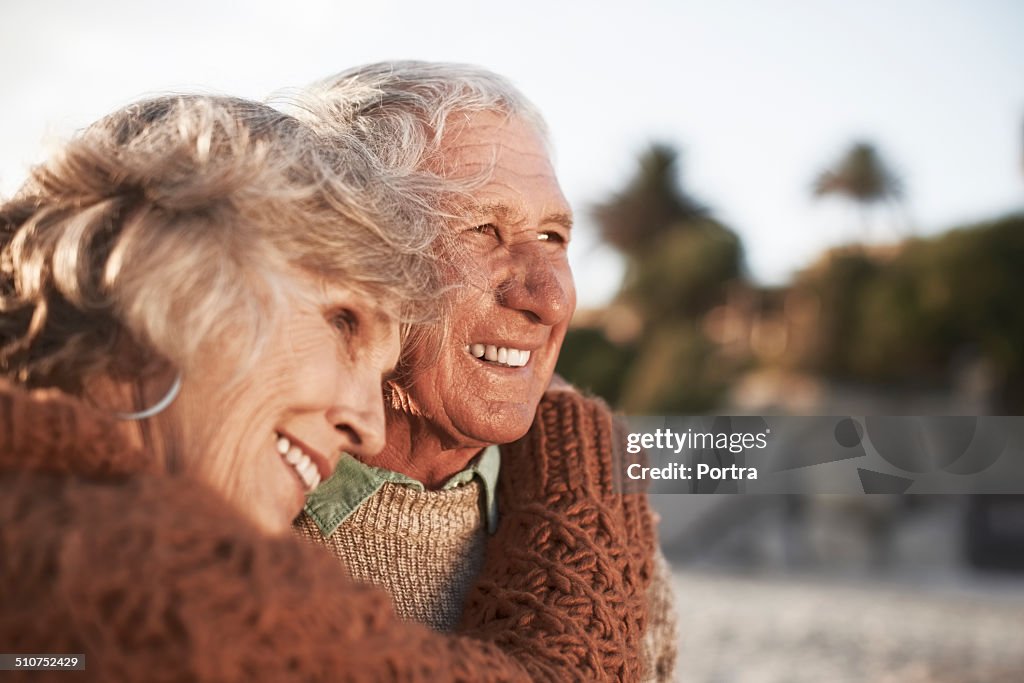 Happy senior couple on beach