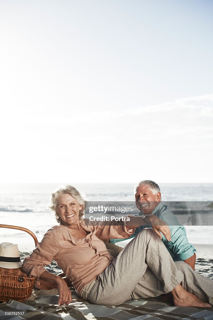 Happy senior couple on beach